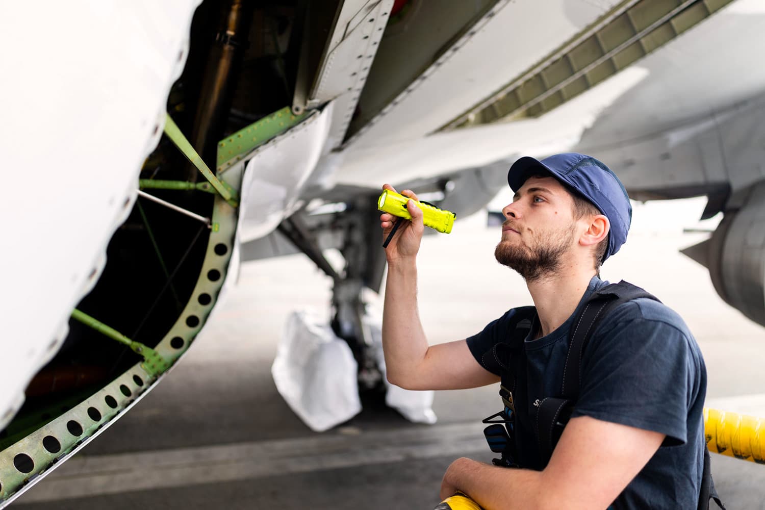 Technical inspection of an aircraft by a maintenance technician at Sabena technics