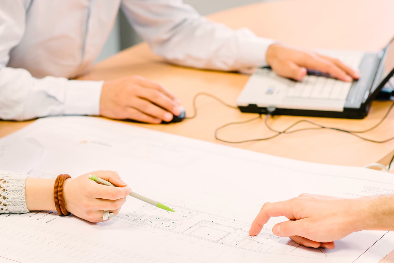 Sabena technics design office during a design meeting, with technical drawings and digital tools