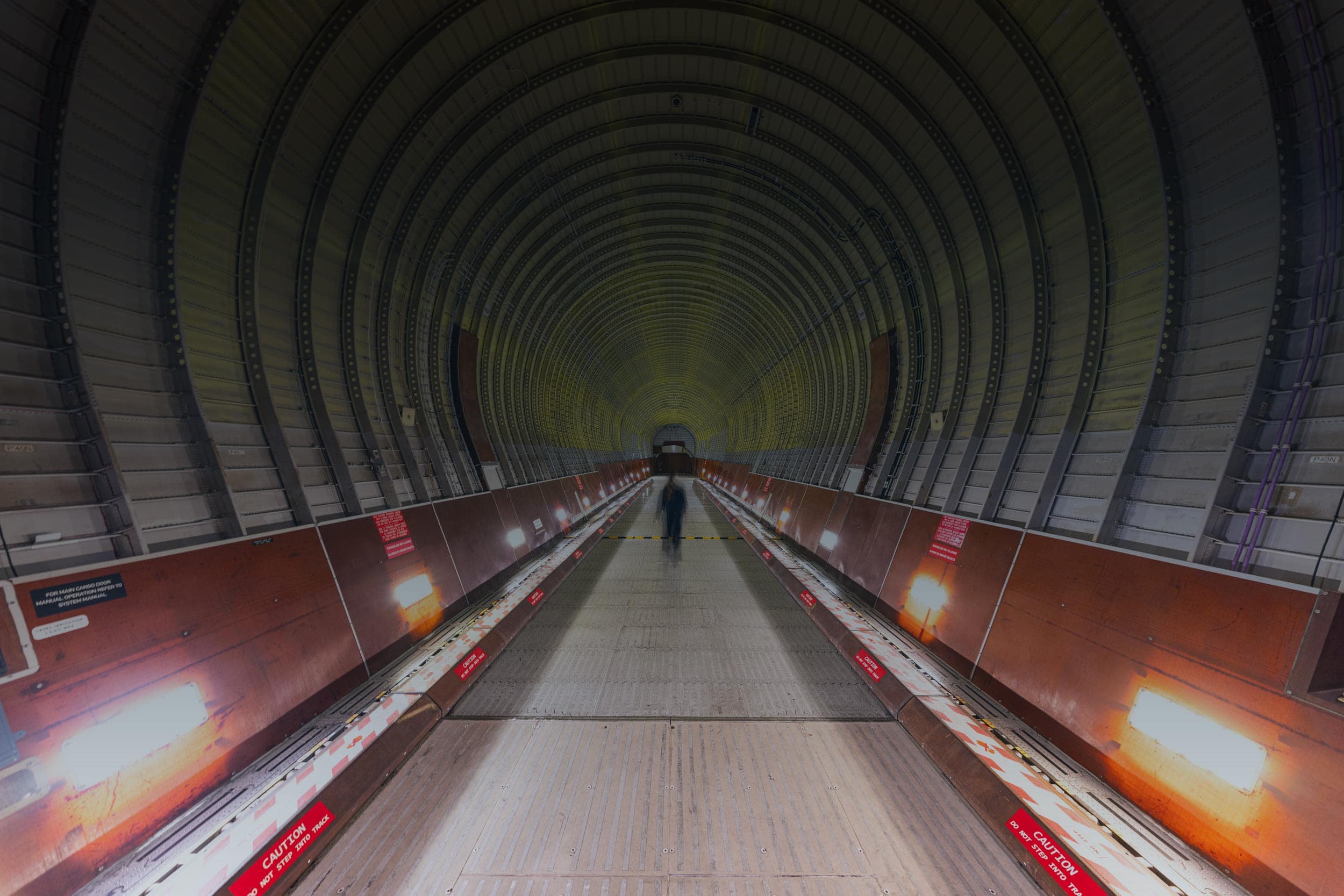 Interior view of an empty aircraft fuselage being maintained by Sabena technics